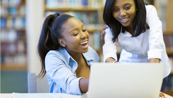 women working together on laptop_small biz solutions