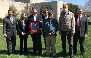 city staff receive the governor's environmental excellend award for the natural playground