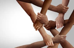 Hands grabbing each other to represent multiculturalism and diversity