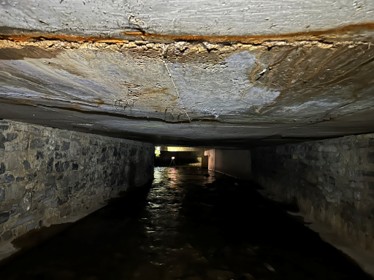 Severe concrete delamination below Wharf Parking Lot access road